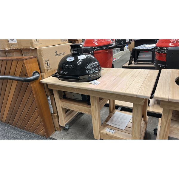 JACK DANIELS PRIMO CERAMIC GRILL. CHARCOAL. MODEL PG00614. COMES WITH WOOD CABINET ON WHEELS