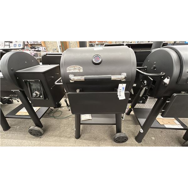 BROIL KING REGAL CHARCOAL GRILL 400. TRUE CHARCOAL GRILLING. HEAVY CAST IRON GRIDS.