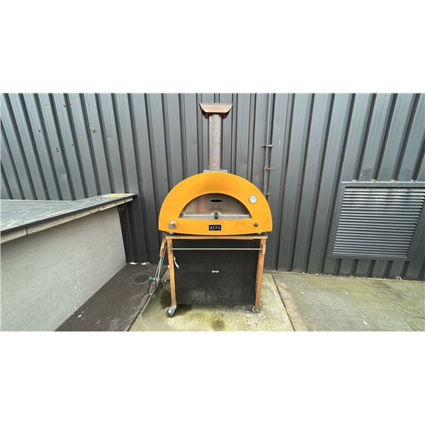 MODERNON PIIZZA OVEN AND STAND. 38"W. PROPANE OR WOOD FIRED. OUTDOOR DEMO UNIT SO REQUIRES
