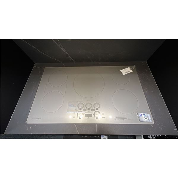 MONOGRAM 36" SILVER INDUCTION COOK TOP WITH 5 COOKING ZONES. MODEL ZHURSTSS RETAIL $8,843