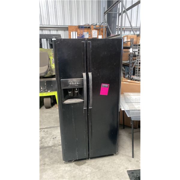 USED FRIGIDAIRE 33" SIDE BY SIDE BLACK FRIDGE. NOT CLEAN. USED IN WAREHOUSE AS STAFF FRIDGE
