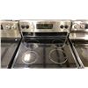 Image 2 : GE MODEL JCBS630SV1SS. BLACK & STAINLESS 4 BURNER GLASS TOP ELECTRIC STOVE