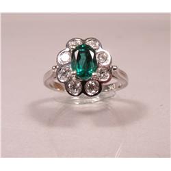 A Ladies 14kt White Gold, Diamond and Emerald Ring,