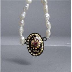 A Strand of Freshwater Pearls with Enamelled Ruby Pendant and Low kt Gold Clasp.