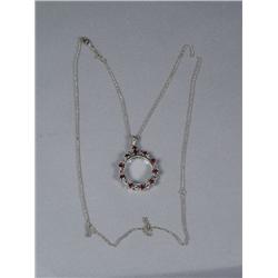 A Sterling Silver Garnet Magnifying Glass Pendant and Chain,