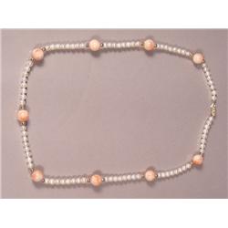 A Coral and Cultured Pearl Necklace with 14 kt gold balls,