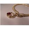 Image 2 : A 14 kt Yellow Gold, Diamond and Garnet Necklace,