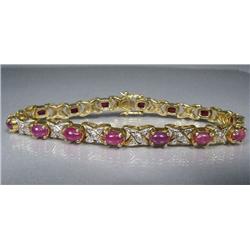 A Sterling Silver and Gold Vermeil Diamond and Ruby Bracelet.