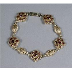 A 14 kt Yellow Gold Garnet Bracelet,
