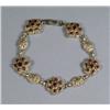 Image 1 : A 14 kt Yellow Gold Garnet Bracelet,