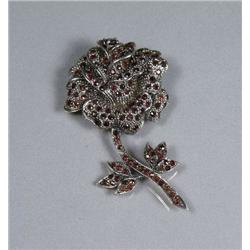 A Sterling Silver Garnet Rose Form Brooch.