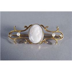 A 10 kt Yellow Gold, Seeded Pearl and Carved Shell Cameo Brooch.