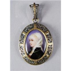 A Silver and Low kt Gold Porcelain Brooch.