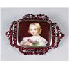 Image 1 : A Garnet and Porcelain Brooch.