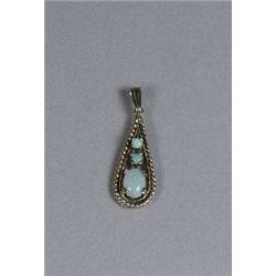 A 14 kt Yellow Gold and Opal Pendant.