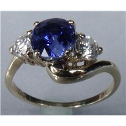 A Ladies 14 kt Yellow Gold, Diamond and Tanzanite Ring