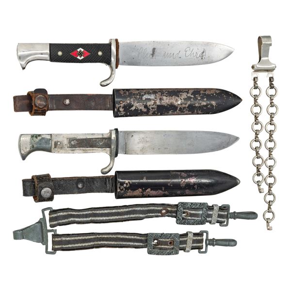 2 WWII GERMAN HJ KNIVES AND 2 DAGGER HANGERS.