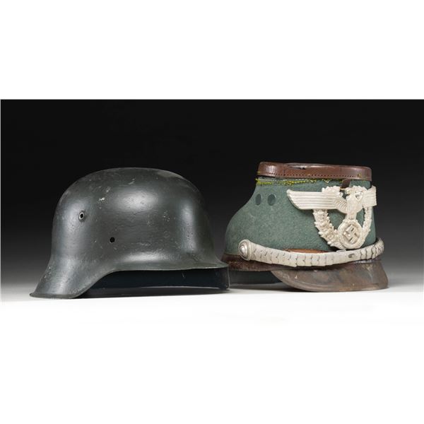 1 WWII GERMAN HELMET SHELL AND 1 POLICE SHAKO.