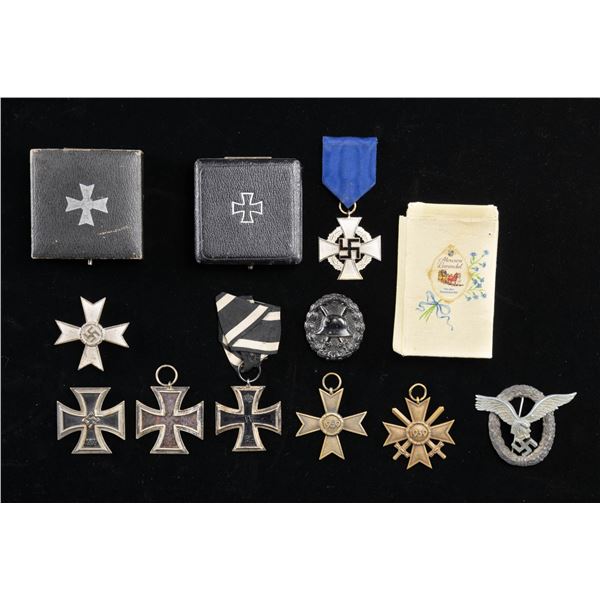 WWII GERMAN MEDALS AND BADGES.