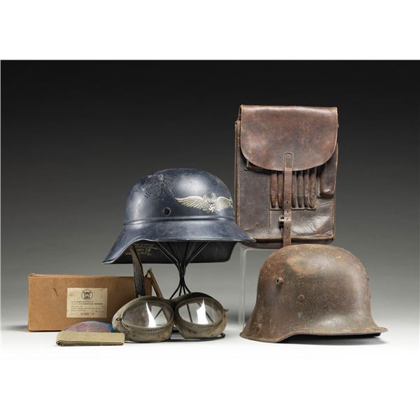 WWII GERMAN HELMETS, MAP CASE, AND GOGGLES.
