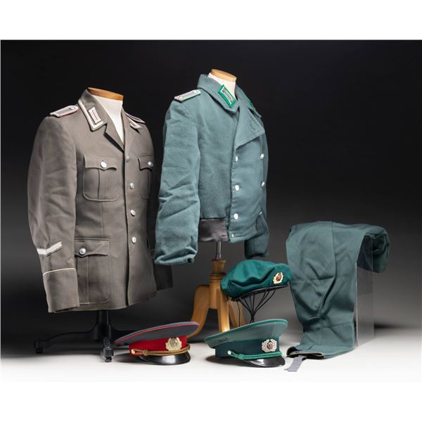 lEAST GERMAN UNIFORMS AND VISOR CAPS.