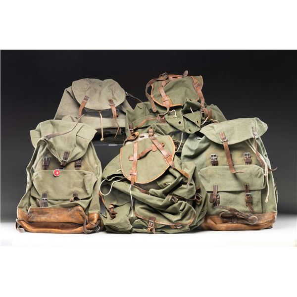 GROUPING OF FIVE MILITARY BACKPACKS.