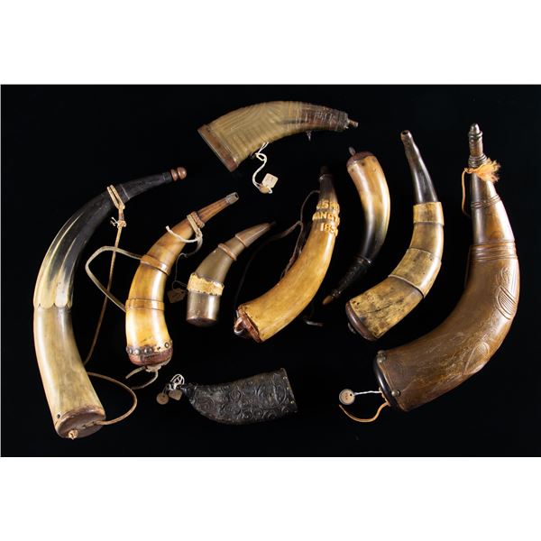 GROUP OF 9 RAISED RELIEF CARVED POWDER HORNS.