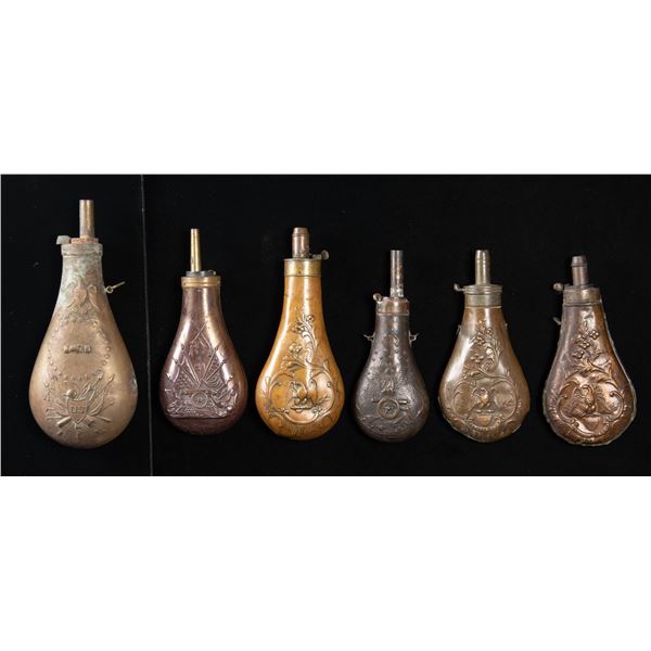 SIX EAGLE POWDER FLASKS.