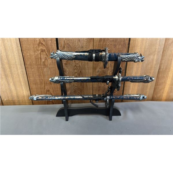 (3) DECORATIVE DAGGERS OF ASSORTED LENGTHS ON A STAND