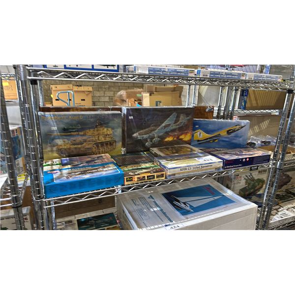 SHELF OF ASSORTED MODEL KITS: AIRPLANES, TANKS, MODEL HEAD SET & CTEHA WALL
