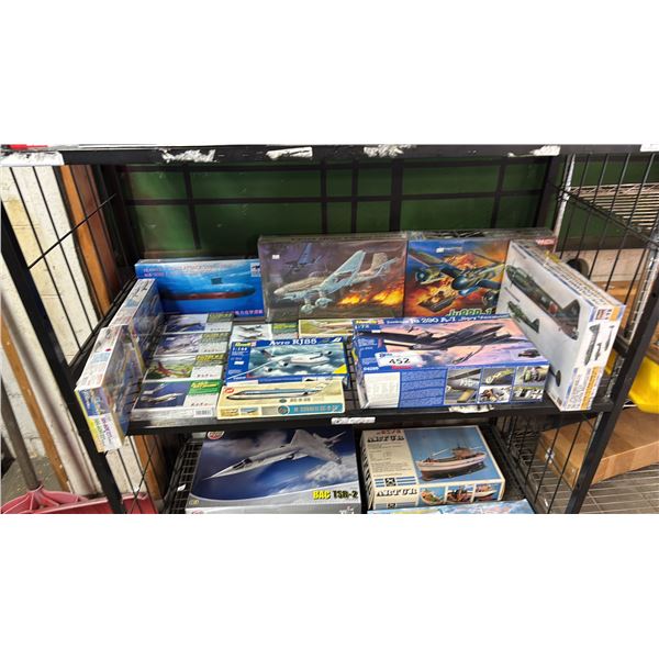 SHELF OF ASSORTED AIRPLANE MODEL KITS