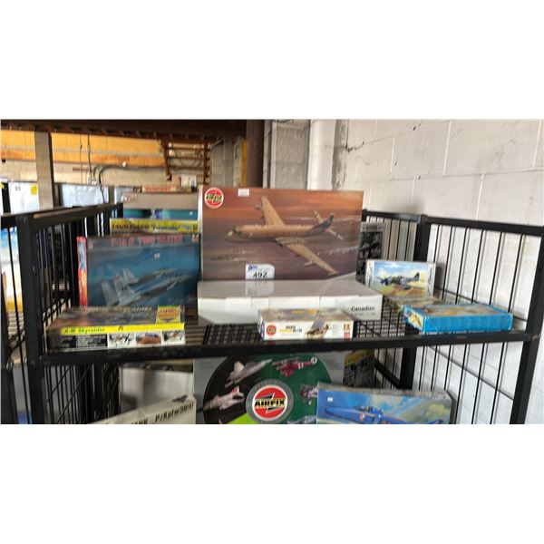 SHELF OF ASSORTED AIRPLANE MODEL KITS