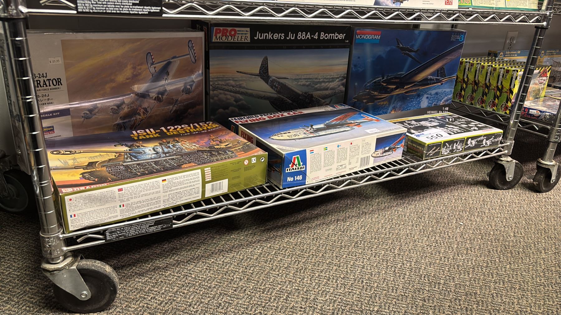 Model Tank Shelf SHELF OF ASSORTED MODEL KITS: AIRPLANES, TANKS & MORE - Able Auctions