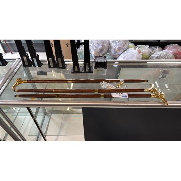 (3) HARDWOOD CANES WITH BRASS LION HEAD HANDLES & 1 EXTRA BRASS & ENAMEL INLAY HANDLE