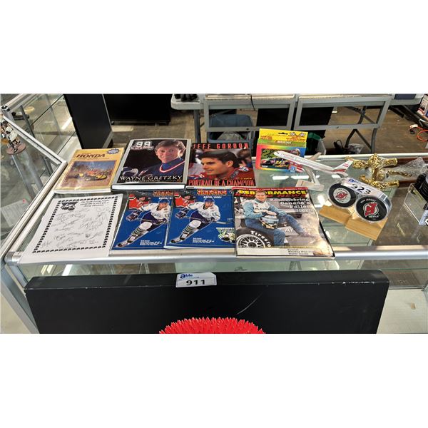 ASSORTED SPORTS MEMORABILIA: MAGAZINES, COFFEETABLE BOOKS, SIGNED HOCKEY PUCKS & MORE