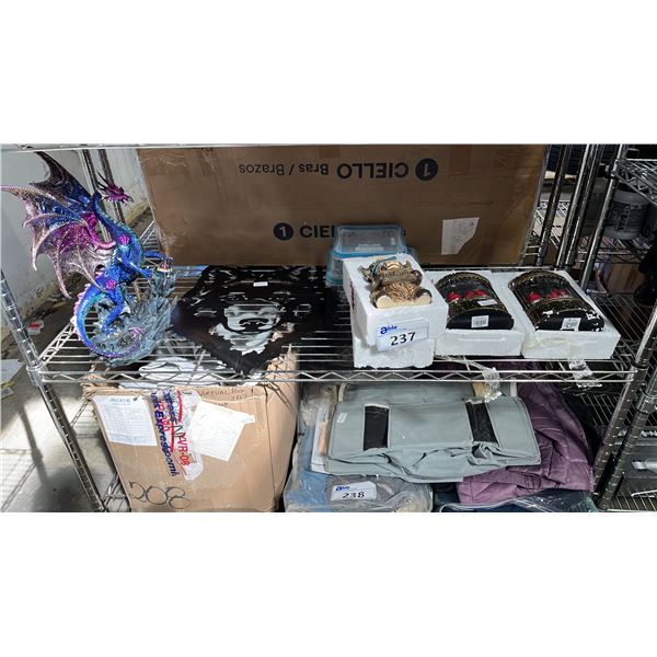 SHELF OF BATTERY OPERATED SNOW LANTERNS, HIGHLAND COW WELCOME STATUE, DRAGON STATUE & MORE