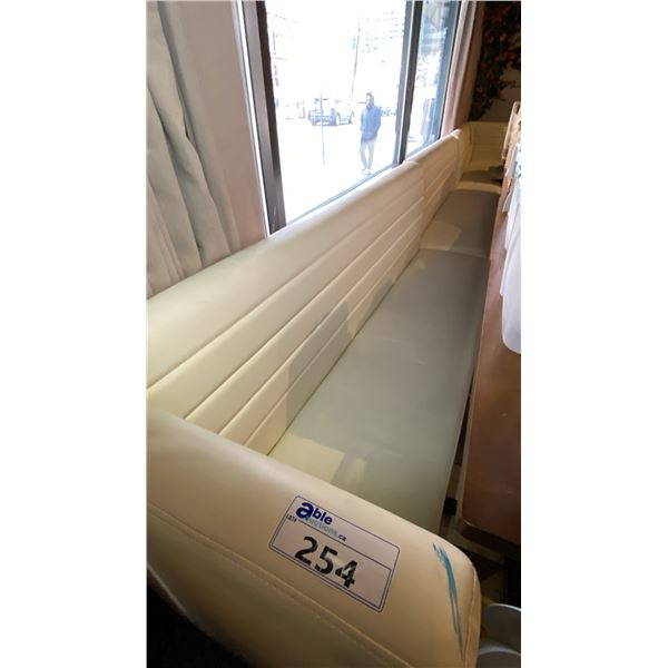 WHITE LEATHER UPHOLSTERED BOOTH/BENCH SEATING - CONSISTS OF (1) 7FT SECTION AND (2) 7FT CORNER SE...