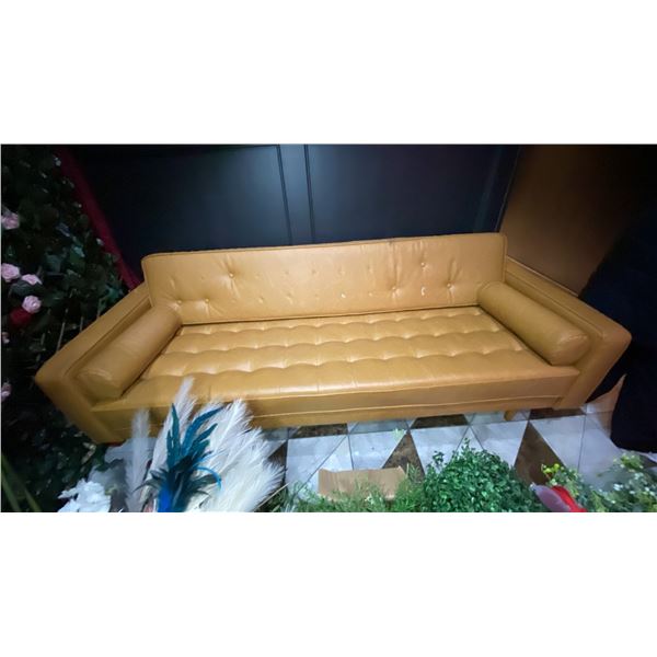TAN VINYL UPHOLSTERED RETRO INSPIRED APPROX. 7FT SOFA *MANY BUTTONS ARE MISSING*
