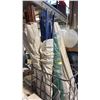 Image 1 : WRAPED ELECTRICAL TAPE BAMBOO POLES, 1 ROLL OF GREEN PLASTIC NETTING AND A METAL CRATE