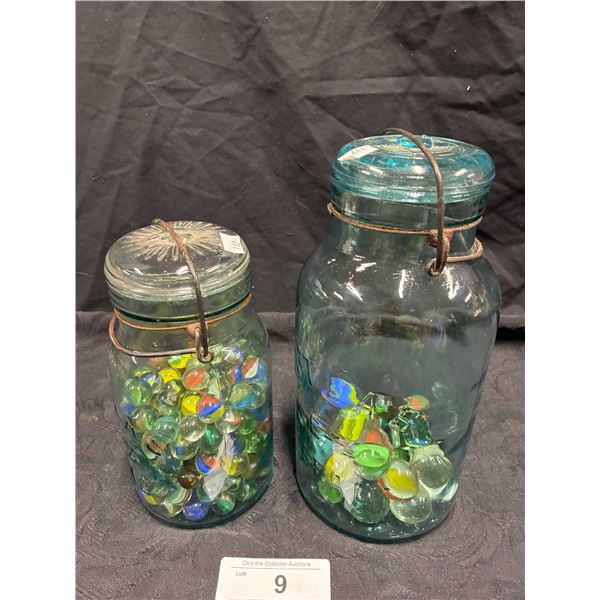 2 antique glass jars with marbles
