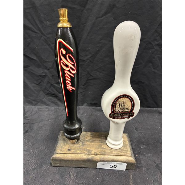 2 beer tap handles on stand