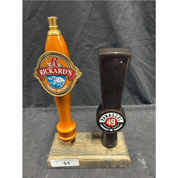 2 beer tap handles on stand