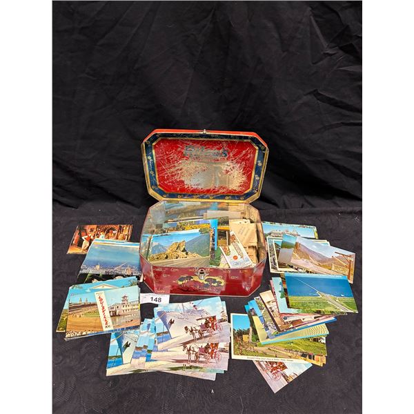 Large collection of vintage post cards in old coffee tin