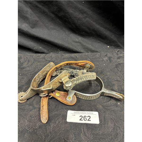 Unmatched pair of vintage riding spurs