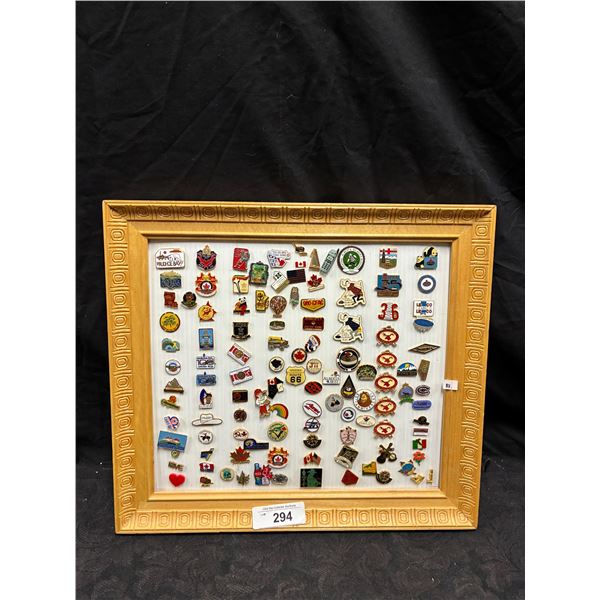 Approx 50 vintage pins framed