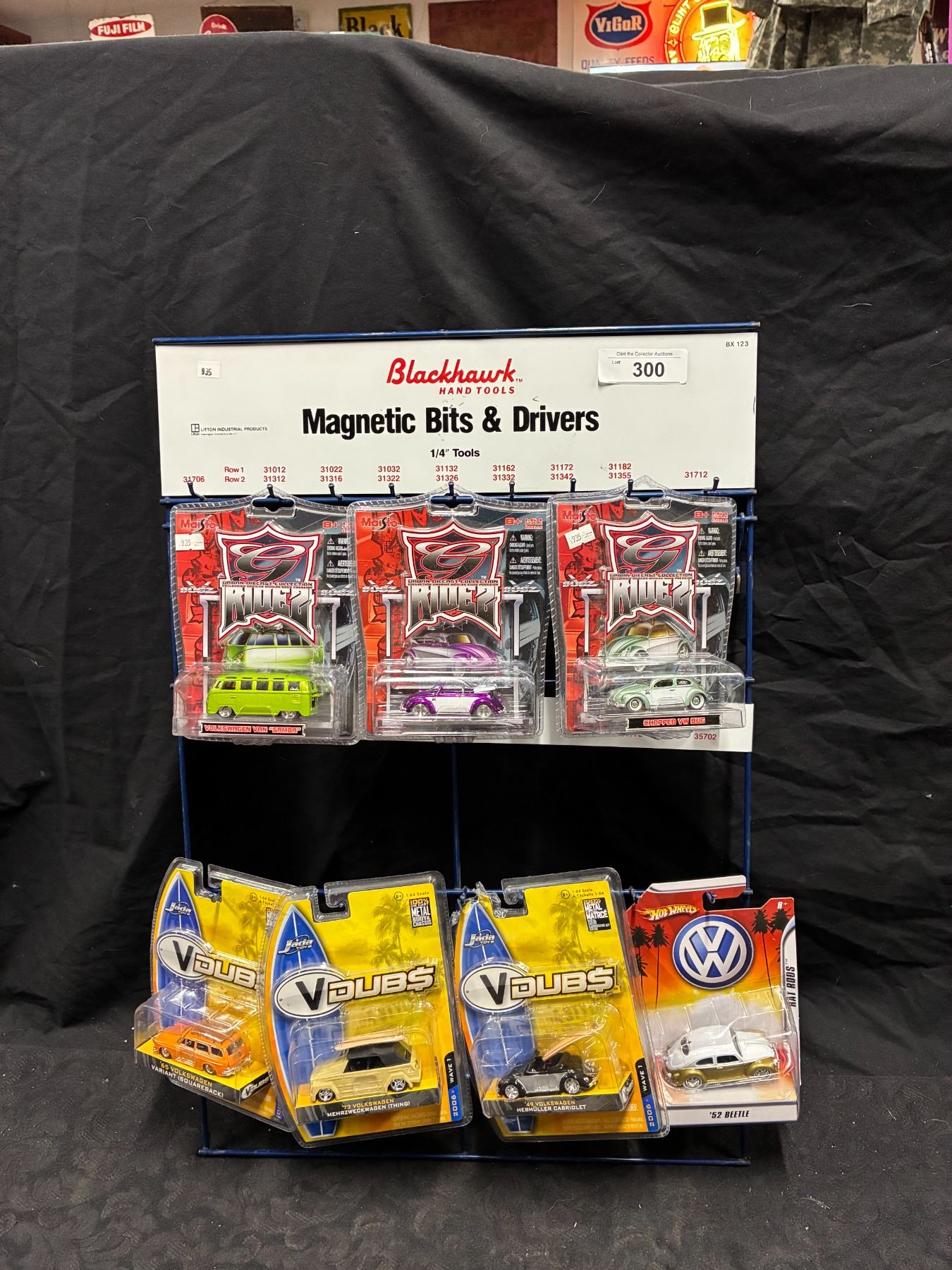 Vintage Blackhawk Tool display rack with 7 NIB die cast cars