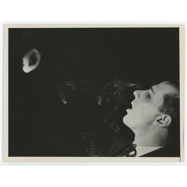 Man Blowing Smoke Ring Photo