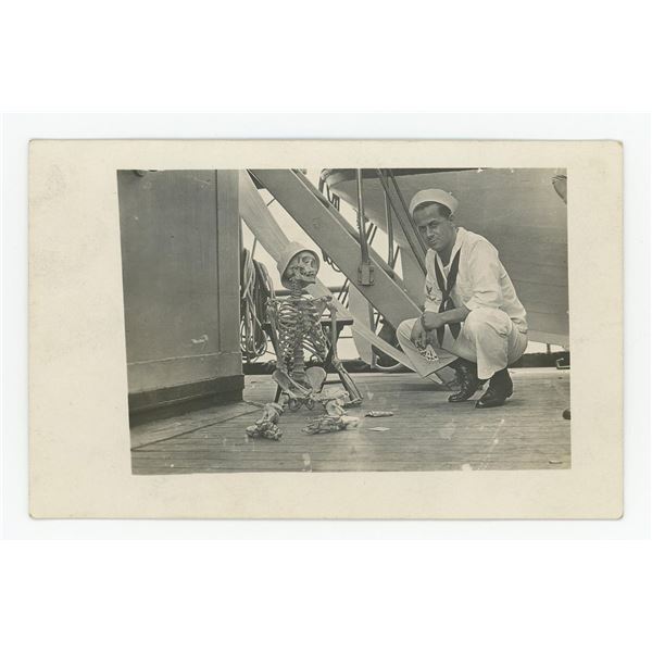 Navy Man Gambling with Skeleton RPPC Postcard