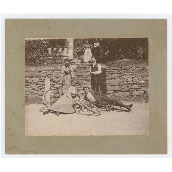 Young Couples Posing on Bicycle Cabinet Photo