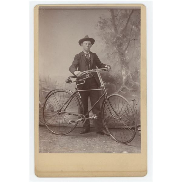 Young Man with Safety Bicycle Cabinet Photo